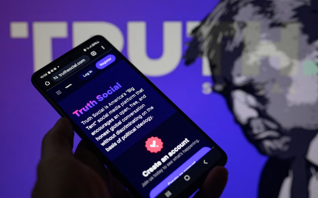 The Truth Social app is being displayed on a smartphone with Truth Social visible in the background in this photo illustration in Brussels, Belgium, on March 27, 2024. (Photo Illustration by Jonathan Raa/NurPhoto) (Photo by Jonathan Raa / NurPhoto / NurPhoto via AFP)