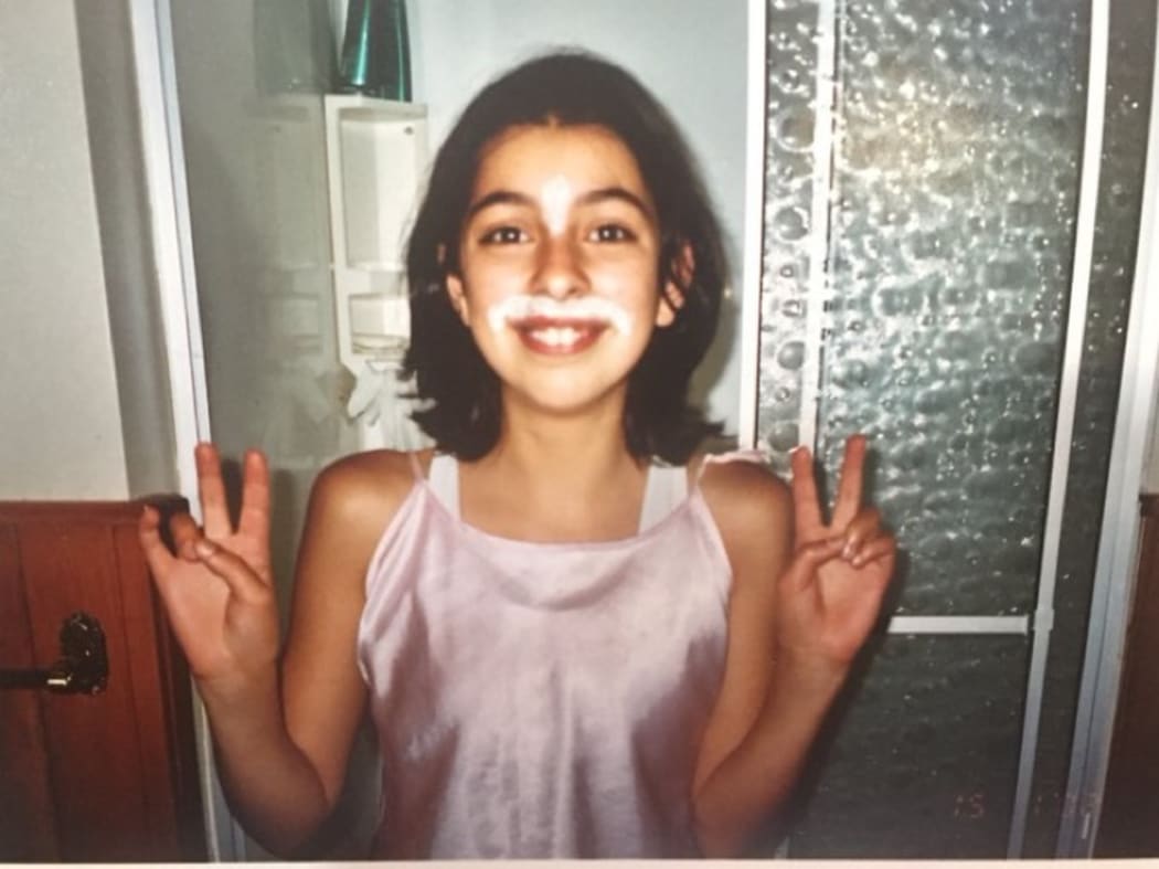 Mava Enoka as a young girl addresses her mo