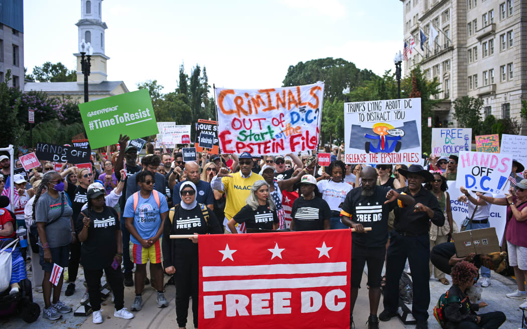 Local residents rally against US President Donald Trump's plans to activate federal law enforcement in Washington, DC.