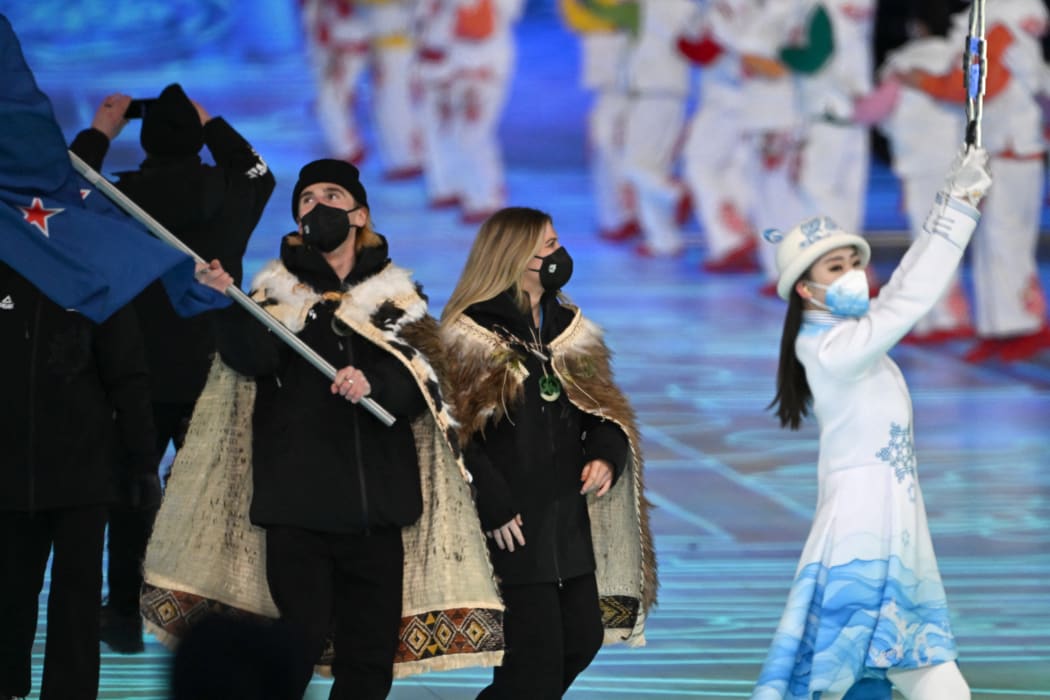 New Zealand's flag bearers Alice Robinson (C) and Finn Bilous lead the delegation during the opening ceremony of the Beijing 2022 Winter Olympic Games, at the National Stadium, known as the Bird's Nest, in Beijing, on 4 February 2022.