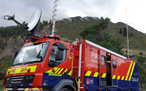 The fire blazes on the hill behind the fire service's command centre outside Hanmer.
