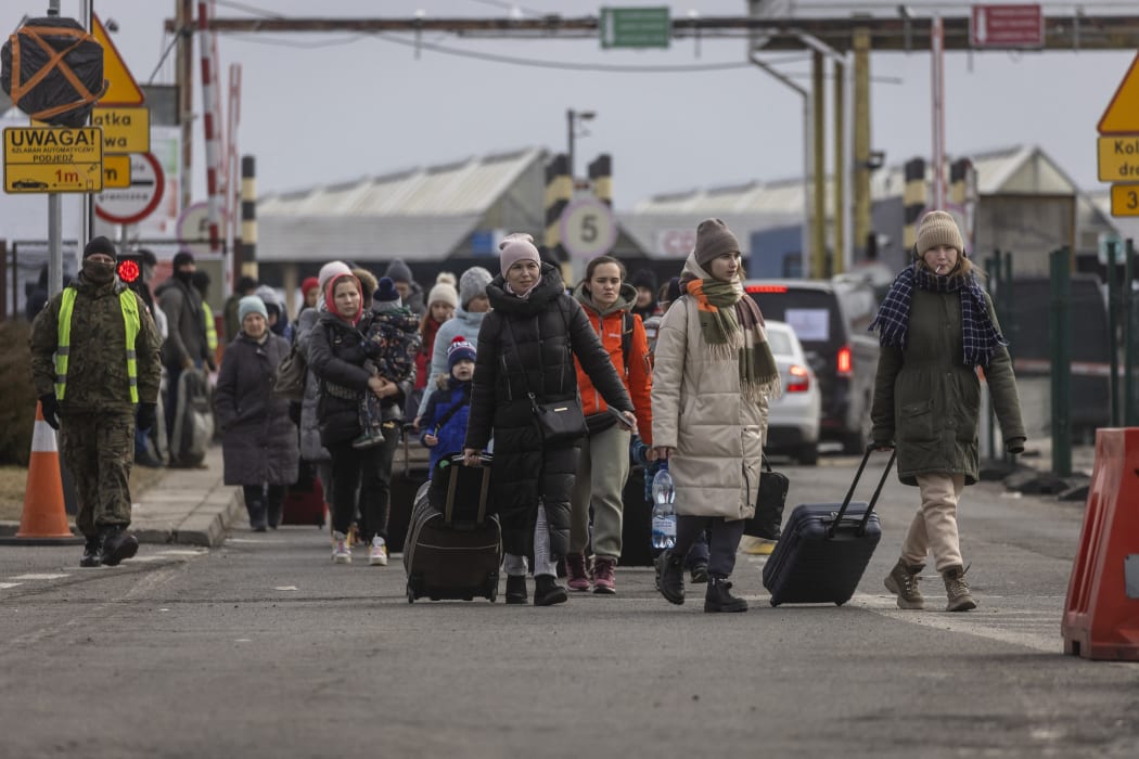 Refugees from Ukraine are pictured after crossing the Ukrainian-Polish border in Korczowa on March 02, 2022.