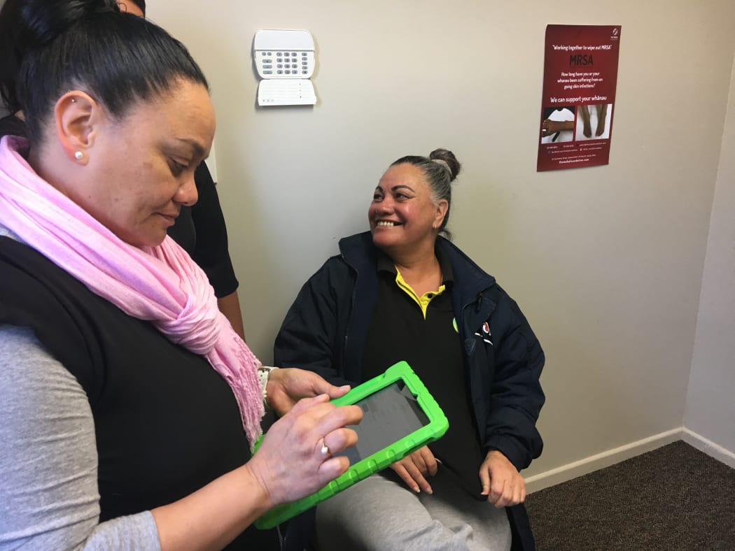 Digital health deputy Janine Maruera prepares for the vitual clinic's first patient Debbie Kiriona.