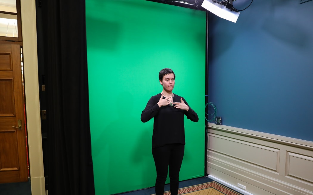 NZ Sign Language interpreter Melissa Sutton (Ngāti Maniapoto) in the Parliament TV sign studio