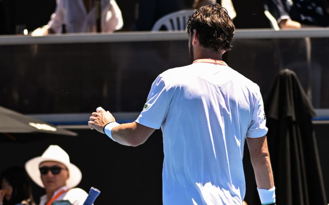 Cameron Norrie of Great Britain throws his racquet in frustration during his game against Facundo Diaz Acosta.