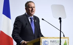 New Zealand's Prime Minister John Key delivers a speech during the opening day of the World Climate Change Conference 2015 (COP21), on November 30, 2015 at Le Bourget, on the outskirts of the French capital Paris.