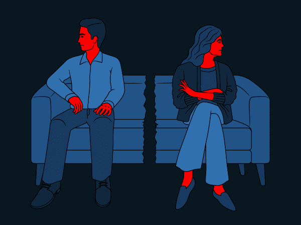 A couple sitting on a sofa facing away from each other.