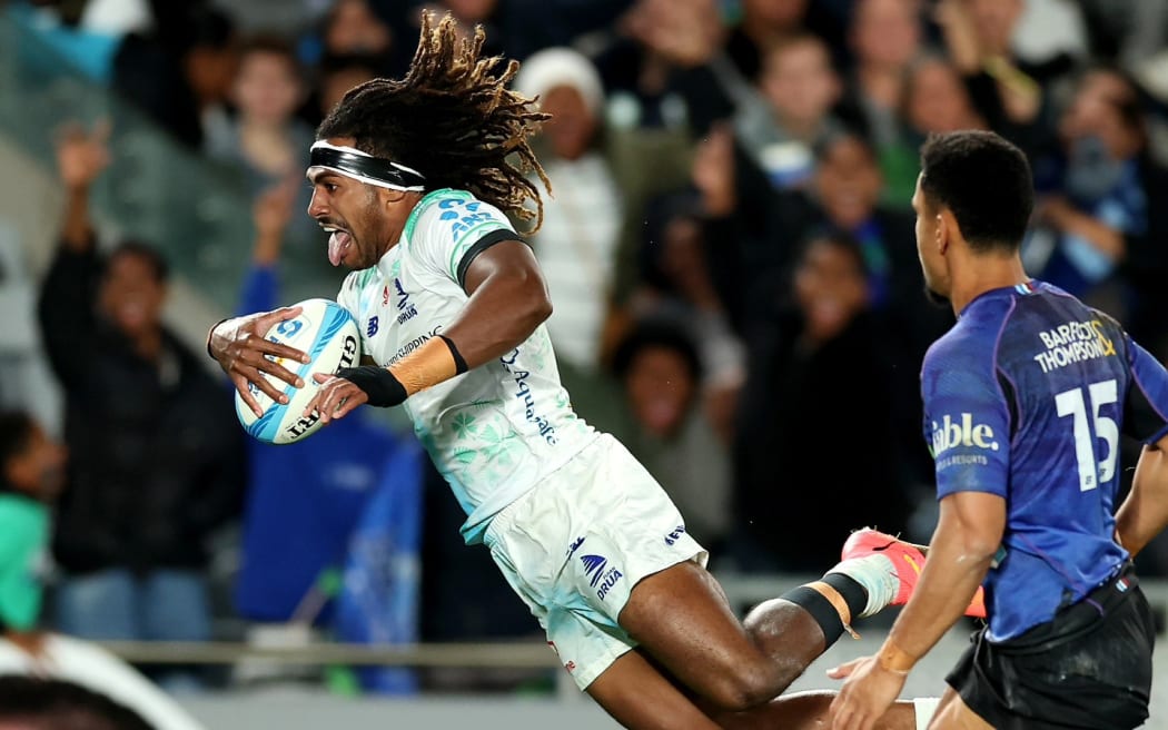 Selesitino Ravutaumada dives to score the Fijian Drua's only try against the Blues at Eden Park on Saturday. Photos: Fijian Drua