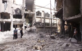 Syrian regime forces stage an airstrike in Douma district of Damascus.
