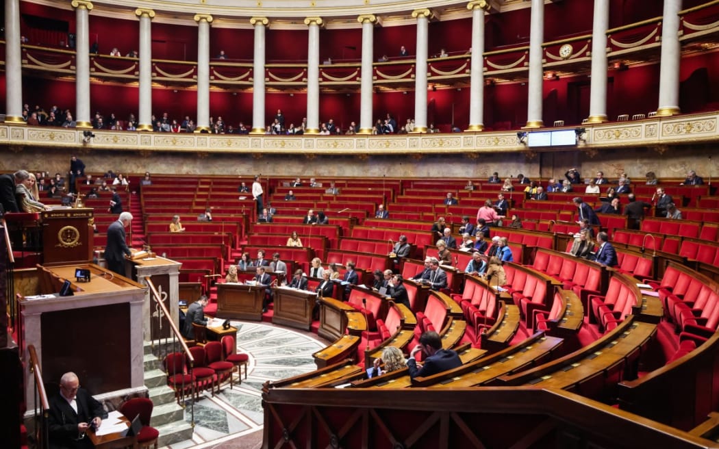 MPs attend a parliamentary debate on legislative process for a social media ban on under-15s at the Assemblee Nationale, France's lower house Parliament in Paris on January 26, 2026.