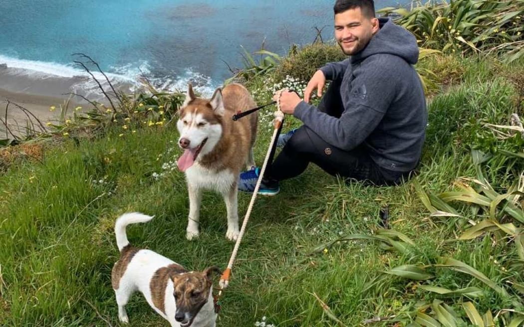 Hurricanes' prop Tyrel Lomax and his dogs enjoying a walk.