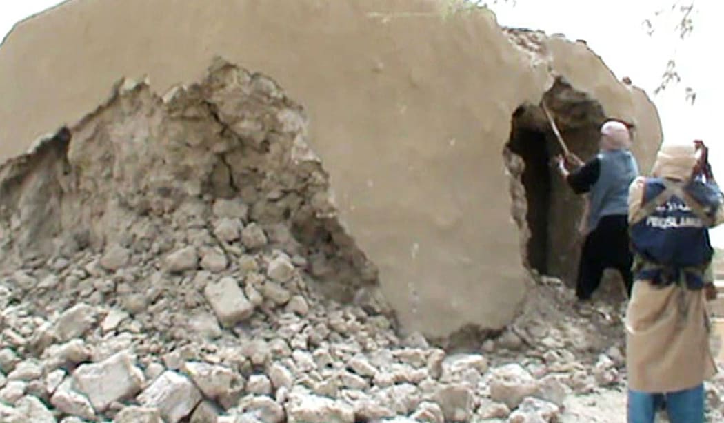 A still from a video shows Islamist militants destroying an ancient shrine in Timbuktu on July 1, 2012