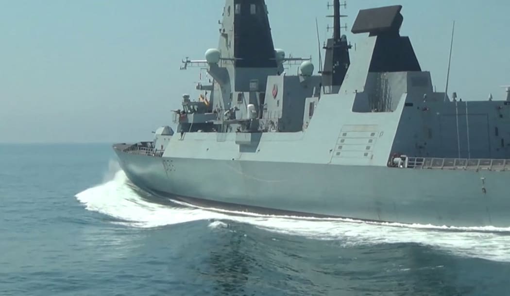 British Navy's Defender destroyer sails in the Black Sea near the Cape Fiolent in Crimea.