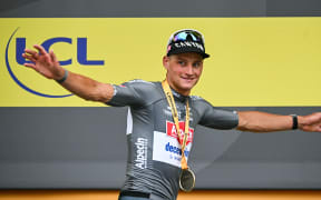 Alpecin-Deceuninck team's Dutch rider Mathieu van der Poel celebrates on the podium after winning the second stage of the 2nd stage of the Tour de France, northern France, 6 July, 2025. (Photo by Loic VENANCE / AFP)