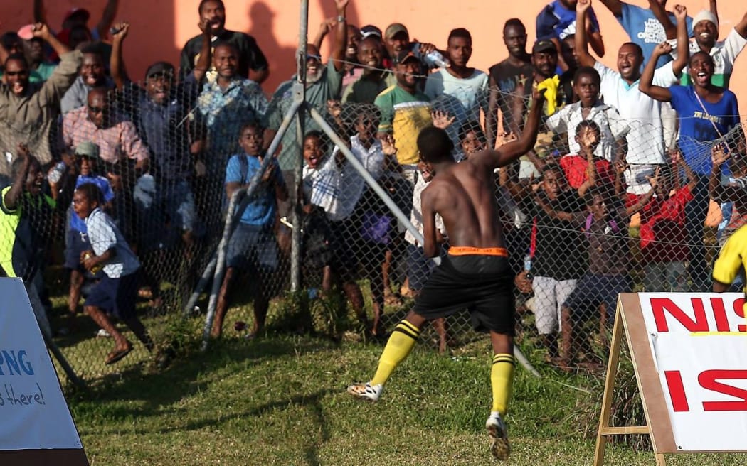 Frederick Massing celebrates scoring the winning goal.
