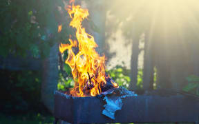 Items being burned outdoors.