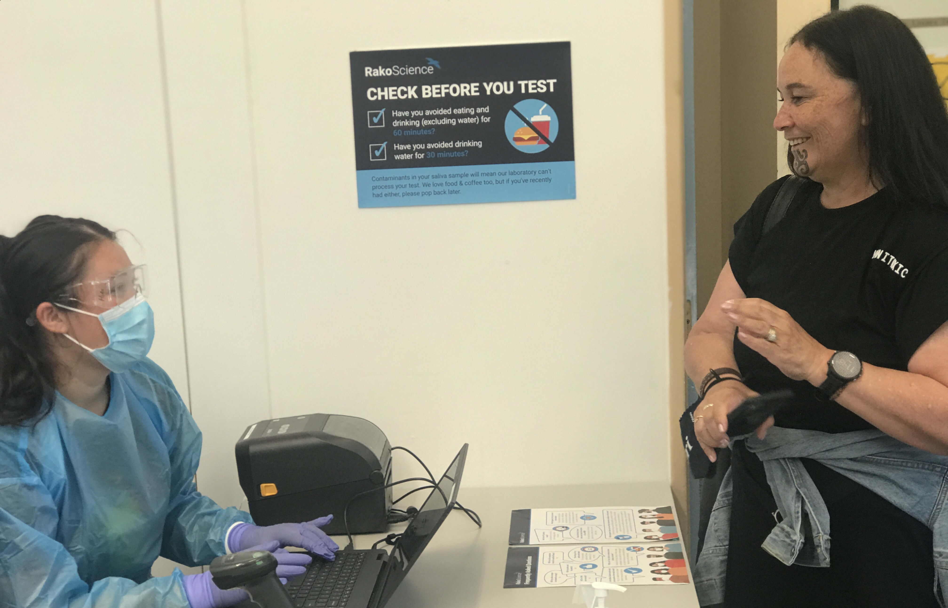 Māori Party co-leader Debbie Ngarewa-Packer meets members of the Manaaki Whānau saliva testing team.
