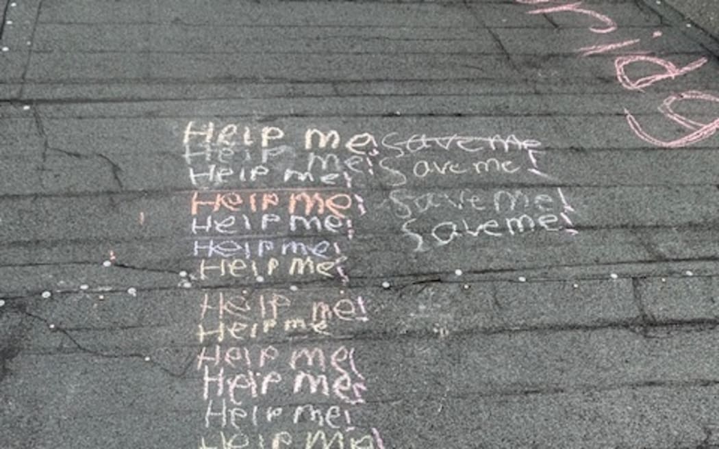Protestors wrote messages on the bridge, once they had taken down the fences to access it, on 13 September, 2025.