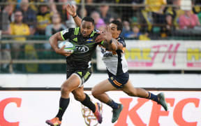 Hurricanes Ngani Laumape breaks a tackle to score a try.