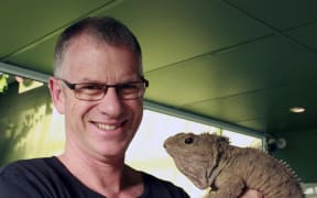 Lindsay Hazley, the tuatara curator at the Southland Museum and Art Gallery, and Henry the tuatara
