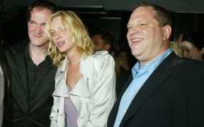 Director Quentin Tarantino (L), actress Uma Thurman, and Harvey Weinstein (R) at the after-party for Kill Bill Vol. 2 in 2004.