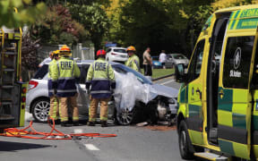 Emergency services attending a serious crash on Ohauiti Road after two cars collided.