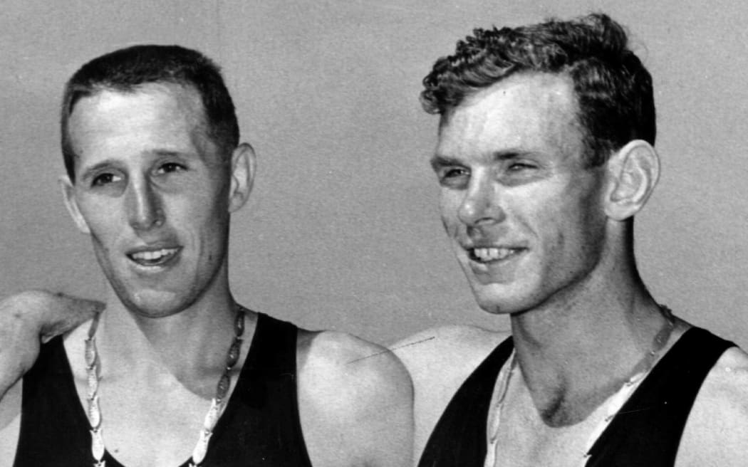 Empire Games Peter Snell (NZL-Gold R) and John Davies (NZL-Silver L) after the 1 mile race.