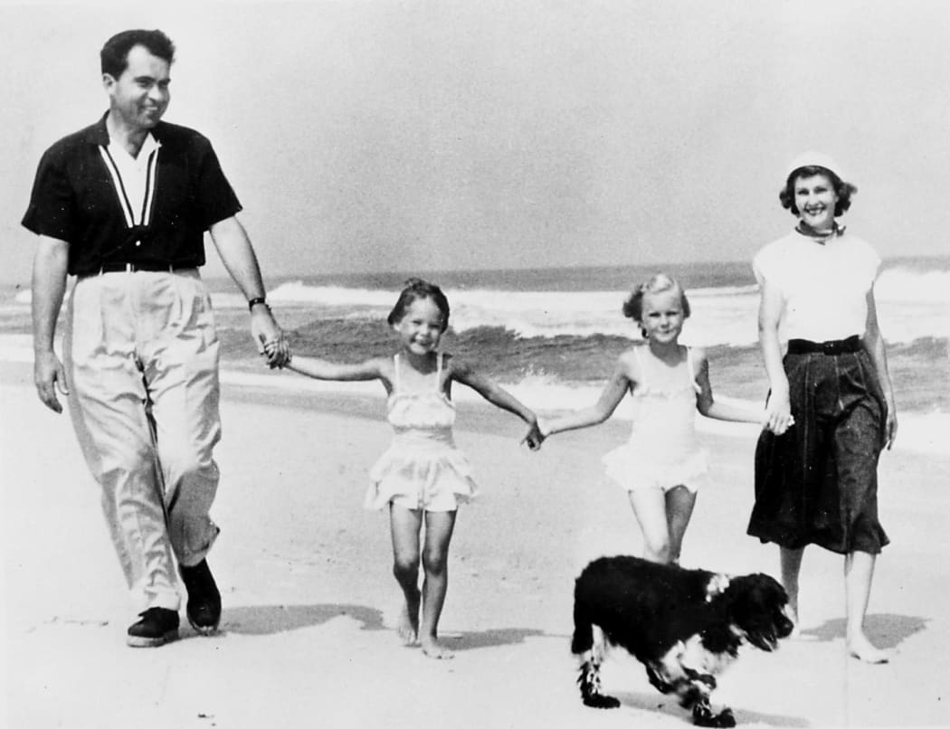 Picture dated 1968 of Republican candidate Richard Nixon having a walk on a beach with his wife Patricia and his two daughters Julie and Tricia and their dog.