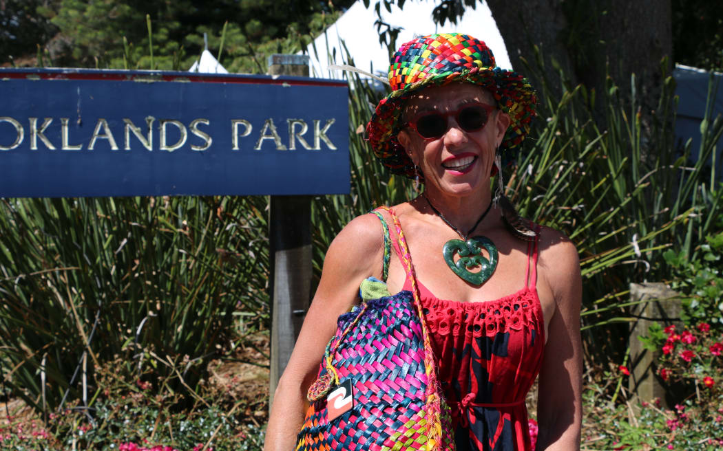 Dressed in colourful kākahu from head to toe, Kaitiana (Christine) Marie Coulter's fit consisted of a pōtae and pēke she weaved herself.