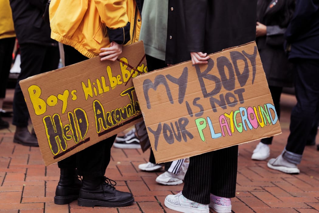 People gathered on Courtenay Place in Wellington to rally against sexual violence.