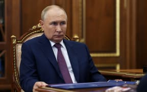 In this pool photograph distributed by Russian state owned Sputnik agency President Vladimir Putin meets with Governor of the Astrakhan region in Moscow, on August 27, 2023. (Photo by Alexander KAZAKOV / POOL / AFP)
