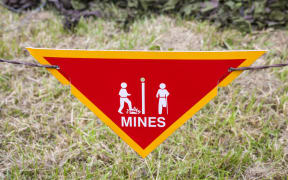 Land mine warning sign