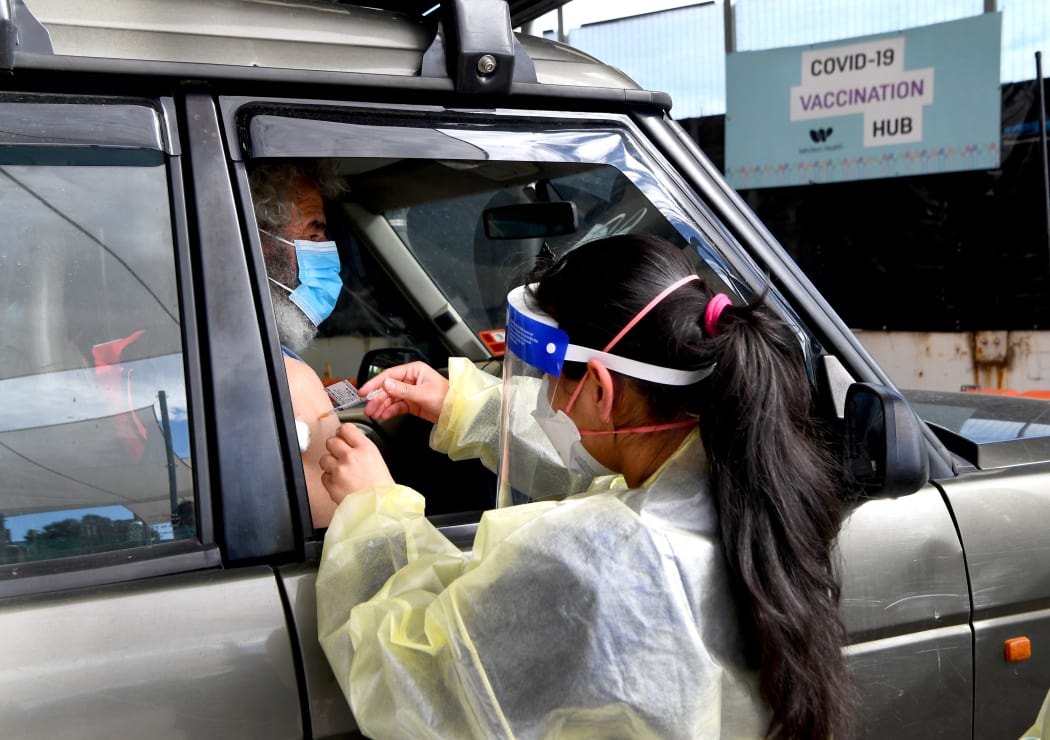 A resident receives a dose of the Pfizer Covid-19 vaccine in a drive-through vaccination centre in Melbourne, Australia on 10 August, 2021.