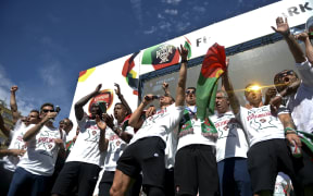 Portugal captain Cristiano Ronaldo and his team-mates on stage at Alameda square in Lisbon on July 11, 2016 where thousands of supporters welcome them with scarfs and flags to celebrate their victory over France in their Euro 2016 final