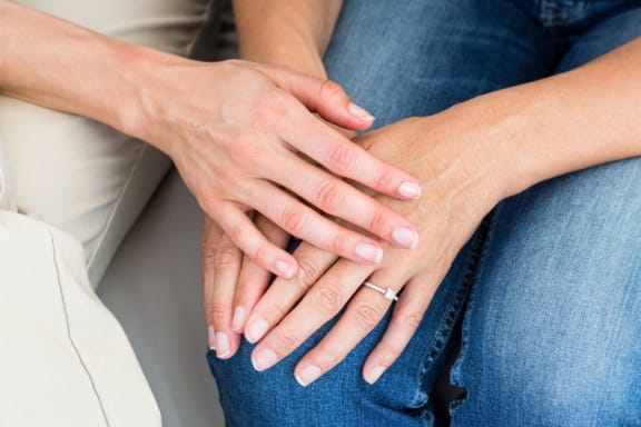 Therapist comforting patient: stock image.
