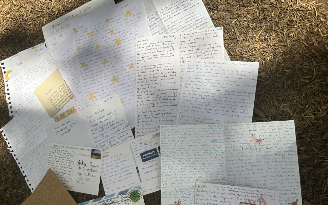 Photo of a collection of letters and postcards.