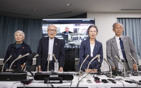 (L-R) Members of the Nihon Hidankyo and atomic bomb suvivors, assistant secretary general Toshiko Hamanaka, co-chair Terumi Tanaka, assistant secretary general Masako Wada and assistant secretary general Jiro Hamasumi pose for photographs during a press conference in Tokyo on October 12, 2024. - The Nobel Peace Prize was on October 11, 2024 awarded to the Japanese anti-nuclear group Nihon Hidankyo, a grassroots movement of atomic bomb survivors from Hiroshima and Nagasaki, also known as Hibakusha. (Photo by Yuichi YAMAZAKI / AFP)