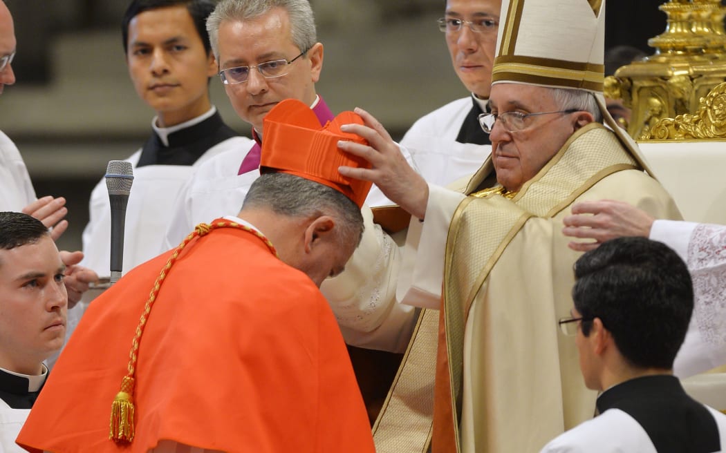 John Dew (L), archbishop of Wellington, New Zealand, is elevated to the rank of Cardinal by Pope Francis.
