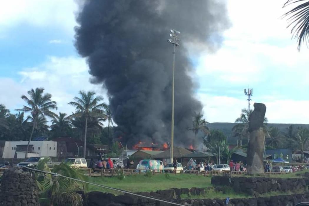 An angry mob torches the courthouse on Rapanui.