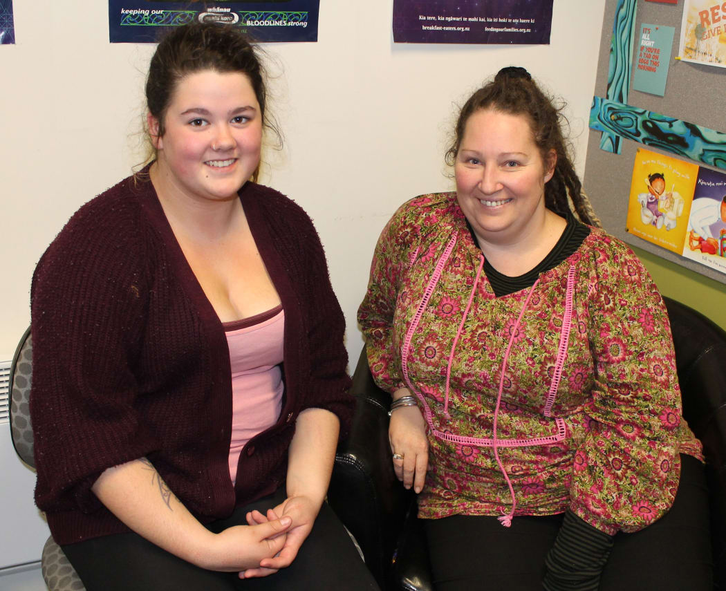 A photo of a young mother, Courtney Watts and her mentor, a social worker, Tasha Pearce