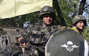 Ukrainian soldiers patrol in the Donetsk region.