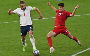 Denmark's midfielder Christian Norgaard vies for the ball with England's forward Harry Kane during the UEFA EURO 2020 semi-final football match between England and Denmark at Wembley Stadium in London