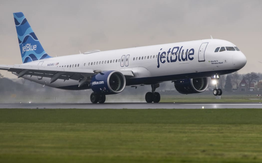 JetBlue Airbus A321neo aircraft flying, landing and taxiing at Polderbaan runway in Amsterdam Schiphol International Airport AMS EHAM in the Netherlands. The narrow body airplane is utilized in transatlantic flights with increased fuel efficiency and range comparing to the predecessors A321ceo. The A321 NEO passenger plane arrived as flight B632 from Boston and departed to New York JFK in the USA.  The single aisle airliner has the tail number registration N4048J, is named &quot; Allow Me To Mintroduce Myself &quot; and is powered by 2x PW jet engines. Jet Blue Airways Corporation is a major United States low-cost airline with a fleet of 291 aircraft serving 114 destinations. March 30, 2024 (Photo by Nicolas Economou/NurPhoto) (Photo by Nicolas Economou / NurPhoto / NurPhoto via AFP)