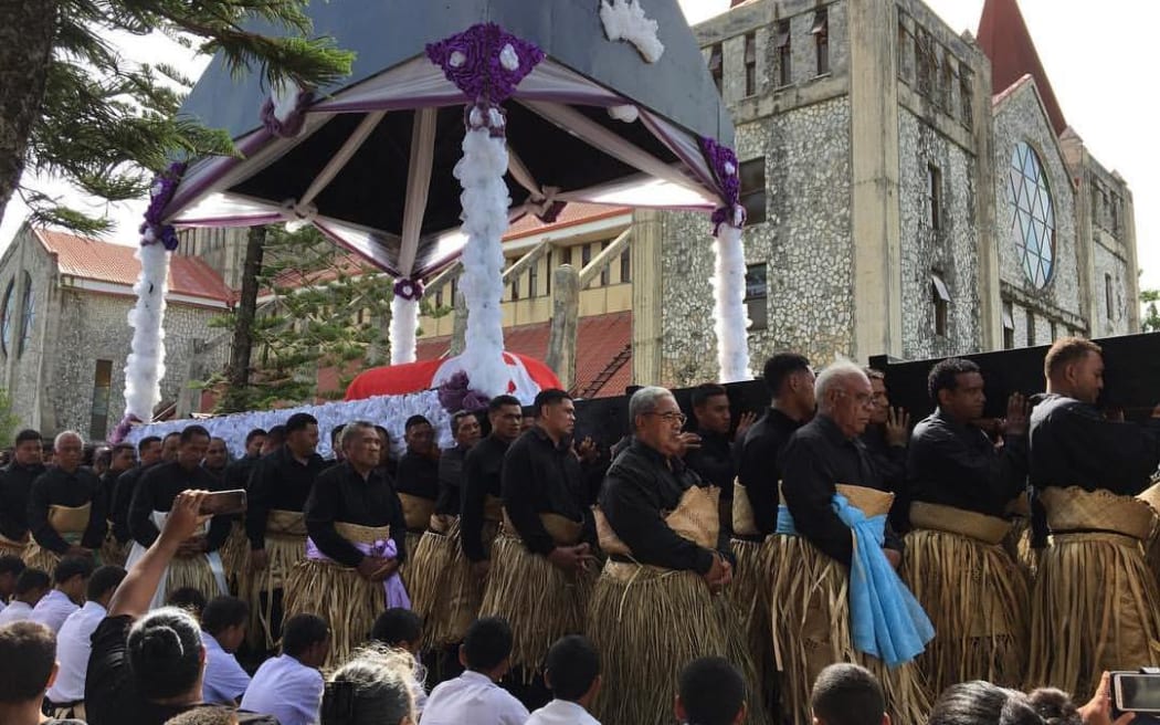 A procession carrying the body of Tonga's late Queen Mother Halaevalu Mata'aho, marches through the capital, Nuku'alofa.