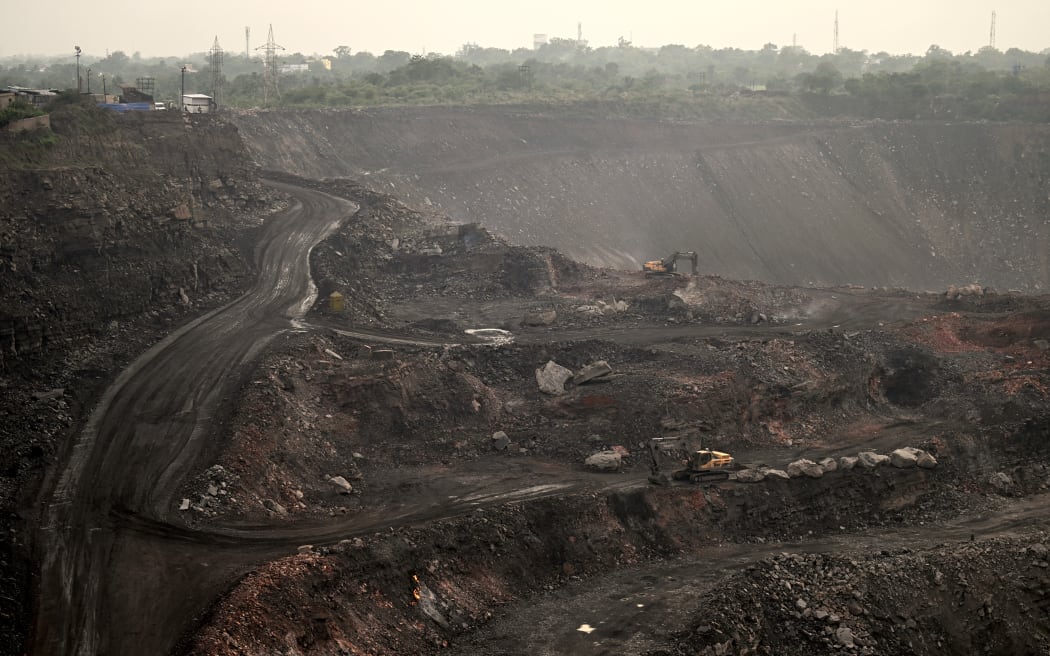 An open-cast coal mine on the outskirts of Dhanbad in India's Jharkhand state on 7 July, 2023.