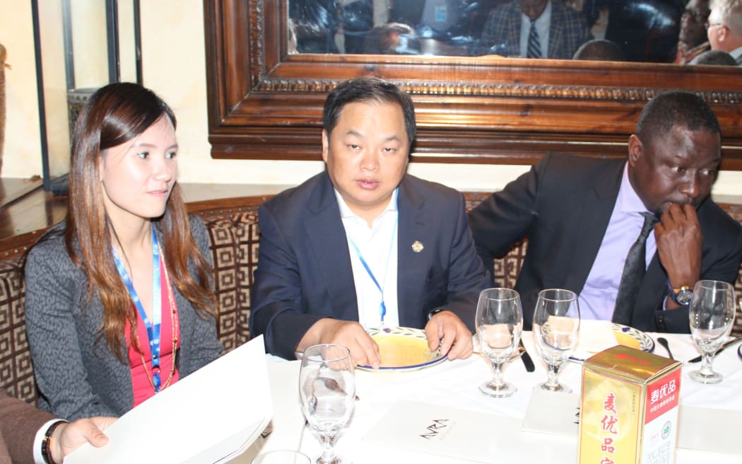 Gina Zhou (left) and Cary Yan (centre) at a restaurant in New York