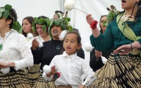 Nataria Winikerei, 7, as the story of Parihaka is performed at the Taranaki Treaty settlement yesterday.