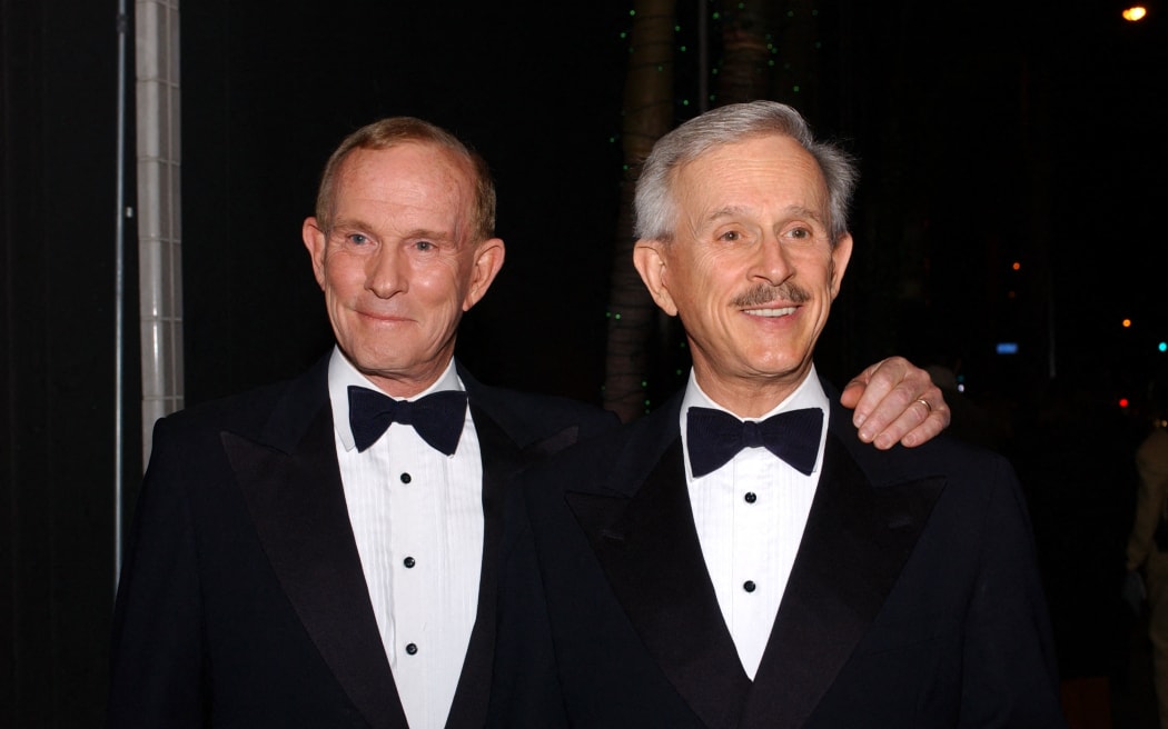 LOS ANGELES - JUNE 3:  Comedians Tom and Dick Smothers ("The Smothers Brothers") pose before their show at the Comedy Store on June 3, 2003 in Los Angeles, California.  (Photo by Amanda Edwards/Getty Images) (Photo by Amanda Edwards / Getty Images North America / Getty Images via AFP)