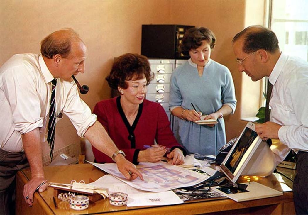In this 1962 photograph, Vic Staines (production), Jean Wishart (editor), Joy Lee (assistant editor) and Michael Wilson (photographer) discuss the design of the 30th-anniversary issue.