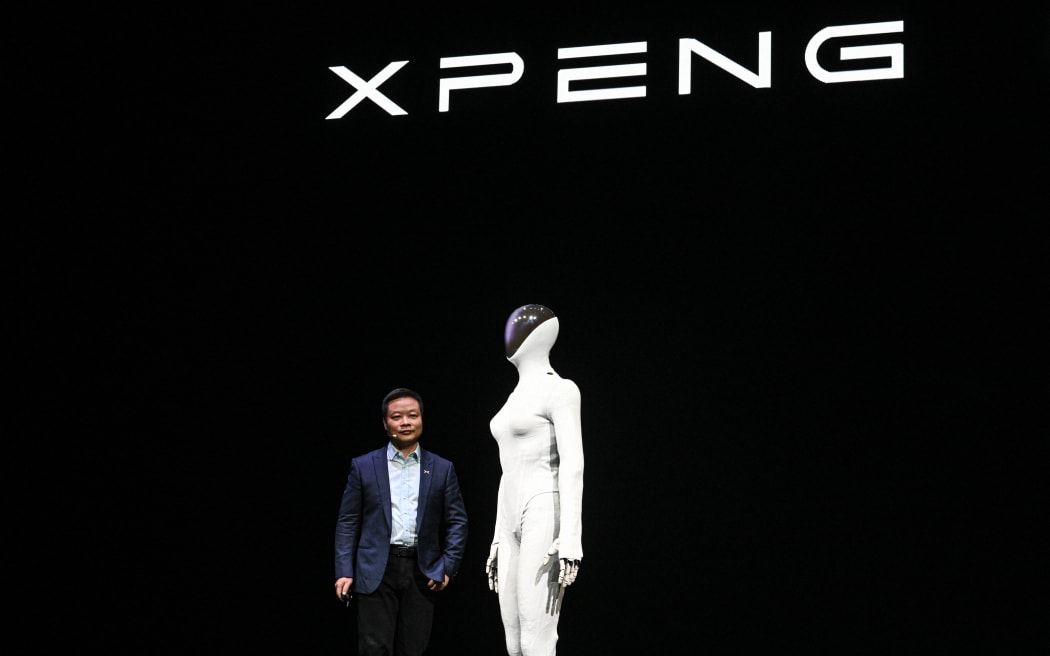 He Xiaopeng, cofounder and chairman of Chinese electric vehicle maker Xpeng, launches Xpeng's next-gen Iron humanoid robot during AI Day press conference at its headquarter in Guangzhou, in southern China's Guangdong province on 5 November, 2025.